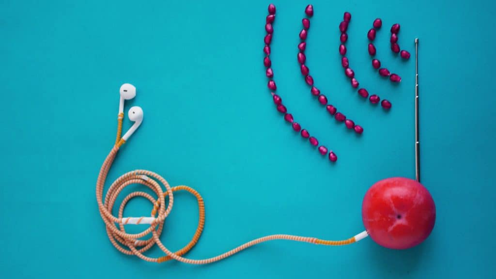 Earphones on a teal background